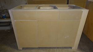lot 38 image: 3-Door & 3-Drawer Floor Cabinet w Slide-out Baskets.  Measures 52.25 x 35.25 x 24.75