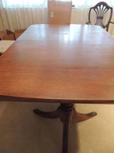lot 18 image: B.P. Johns Mid Modern Dining table 2 PEDISTAL Legs 3 Claw Feet on each,  has padded cover and 3 leaves,  table without leaves  30x58x40 each leaf is 12x40  total length is 94