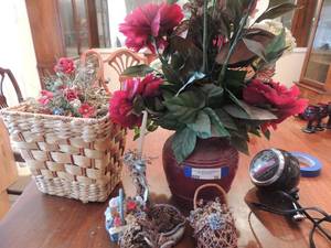 lot 56 image: Wicker baskets with floral Baby stroller with floral 9 vase with floral arrangement