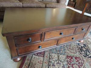 lot 11 image: Dark wooden solid coffee table with 5 drawers 18x52x28