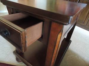 lot 12 image: Dark wood end table 1 drawer open bottom round feet 26x26x19