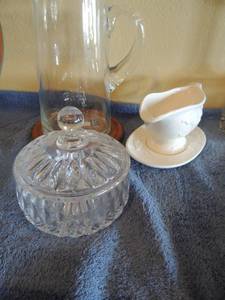 lot 110 image: 10 water pitcher on wooden base, plate for gravy boat and covered glass candy dish