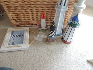 lot 71 image: Light house lot- art 9x7, light house stand 4x3, gray and seashell house 15 tall, Cape Mat N.J 7 Cape Hatteras NC 7 Electric stained glass lighthouse 11 tall