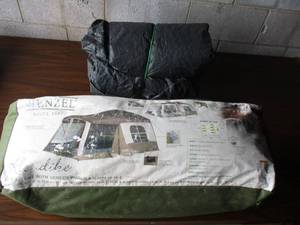 lot 83 image: Wenzel-Klondike Cabin Tent With Screen Porch, And a Ozark Trail Model HK-5100 17-Ft x 11-Ft Dome Tent