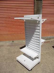lot 126 image: 2-Sided Portable Display Stand On Casters With 4-Adjustable Shelfs