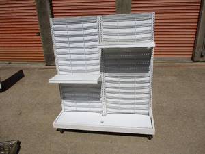 lot 123 image: 2-Sided Portable Display Stand On Casters, With 6-Adjustable Shelfs, Bag of Peg Hooks And Some Price Holders.