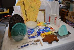 lot 203 image: Pizza Pans, Strainer, Pottery Mixing Bowl, Plastic Wrap as shown
