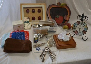 lot 205 image: Shadow Box with Apples, Nut Crackers, Can Openers, Teak Square Cutting Board, Cloth Napkin Sets, see pictures