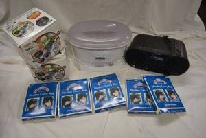 lot 217 image: Stroller Carry Bag, Chefs Rival Slicing and Grating Machine, Dr. Scholls Heater, Sony Alarm Clock Radio