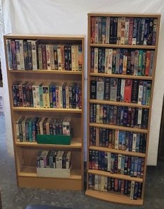 lot 73 image: Large amount of opened and Unopened VHS Movies with Storage Shelves