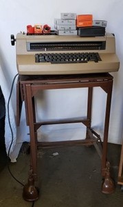lot 84 image: IBM Correcting Selectric 3 Typewriter with accessories and Rolling Vintage Metal Typewriter Cart
