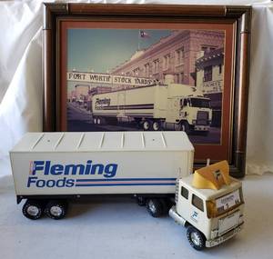 lot 64 image: Fleming Foods GMC 18 Wheel Model Truck, Rolltop Rear Door and Wooden Pallet with notepad Plus Framed Photo of Fleming Truck at Stockyards