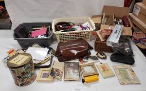 lot 142 image: Misc. lot of Key chains, Small cases, sunglasses, Hair Bands, wall frames, see pictures