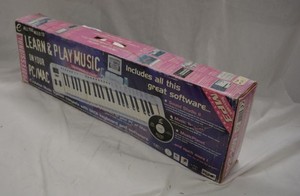 lot 242 image: Evolution Learn & Play Music Keyboard and Software