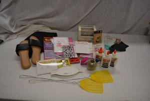 lot 256 image: Misc Lot of stationery, fly swatters, sandals, and tablecloth