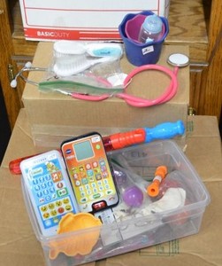 lot 262 image: Toys Includes, Vtech Preschool Phones, Bubble Wands, Stethoscope and Brushes