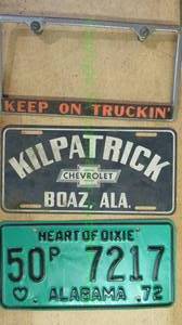 lot 62 image: Vintage Alabama license plates including Kilpatrick Chevrolet Boaz, AL