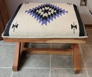 lot 14 image: WOOD BASE WITH UPHOLSTERED SEAT ACCENT STOOL IN STYLE, COLOR, AND CONDITION SHOWN. 21 W x 18.25 D x 17.5 H