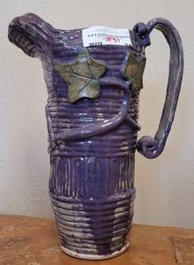 lot 31 image: GLAZED CERAMIC-STYLED PITCHER IN STYLE, COLOR, AND CONDITION SHOWN.
