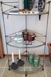 lot 42 image: 3-TIER CORNER DISPLAY WITH GLASS SHELVES IN STYLE, COLOR, AND CONDITION SHOWN. CONTENTS NOT INCLUDED 20W x 15 D x 36 H
