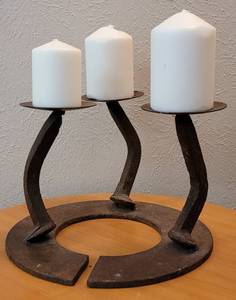 lot 54 image: CUSTOM MADE IRON CANDLE HOLDER WITH CANDLES IN STYLE, COLOR, AND CONDITION SHOWN.