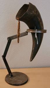 lot 78 image: CUSTOM MADE IRON STAND WITH HORN AS SHOWN.