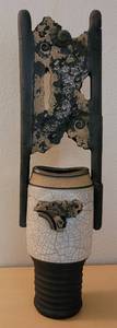 lot 81 image: SHELDON GANSTROM CERAMIC VESSEL LID IN STYLE, COLOR, AND CONDITION SHOWN. THIS PIECE SHOWS REPAIRS. SEE PICTURES. 36 HIGH