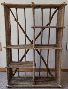 lot 118 image: DECORATIVE SHELF UNIT CRAFTED FROM TREE LIMS IN STYLE, COLOR, AND CONDITION SHOWN. 21.5 W x 9.5 D x 31 H