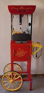 lot 121 image: NOSTALGIA ELECTRICS OLD FASHIONED MOVIE TIME POPCORN CART MODEL CCP-200 AS SHOWN. 22 W x 14 D x 47.5 H CHECK IT OUT