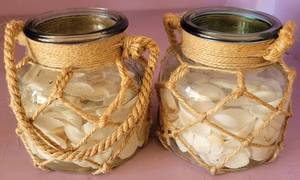 lot 126 image: LOT OF 2 DECORATIVE VASES WITH SHELLS IN STYLE, COLOR, AND CONDITION SHOWN. (YOUR BID X 2)