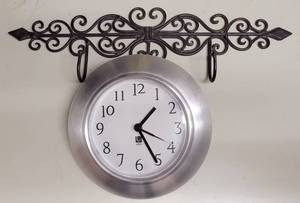 lot 136 image: IRON WALL DECOR WHANGERS PLUS CLOCK AS SHOWN.