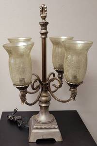 lot 150 image: HEAVY BASE BUILT 4-LIGHT LAMP IN STYLE, COLOR, AND CONDITION SHOWN. TESTED AND POWERS ON. 15 W x 15 D x 28.5 H