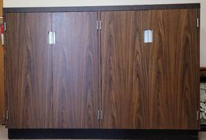 lot 156 image: LARGE CABINET WITH SHELVESSTORAGE AREA IN STYLE, COLOR, AND CONDITION SHOWN. 60 W x 14 D x 42.25 H