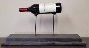 lot 161 image: METAL WINE BOTTLE STAND  HOLDER IN STYLE, COLOR, AND CONDITION SHOWN. BOTTLE NOT INCLUDED. 23.25 W x 6 D x 9.25 H