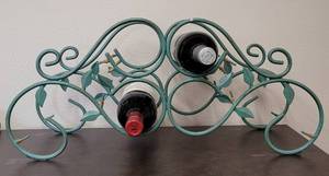 lot 181 image: IRON WINE BOTTLE RACK  HOLDER IN STYLE, COLOR, AND CONDITION SHOWN. BOTTLES NOT INCLUDED 23 W x 7.25 D x 10.25 H