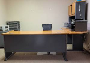 lot 192 image: L-SHAPED OFFICE DESK WITH HUTCH AND STORAGE AREA IN STYLE, COLOR, AND CONDITION SHOWN. CONTENTS NOT INCLUDED 100 W x 62.5 D x 65.5 H