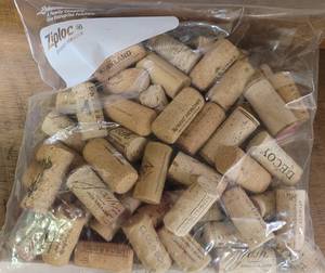 lot 204 image: LOT OF WINE BOTTLE CORKS IN BAG AS SHOWN.