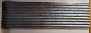 lot 222 image: CORRUGATED GALVANIZED PANEL AS SHOWN. BUYER IS RESPONSIBLE FOR PROPERLY REMOVING UNSCREWING FROM WALL. 84 L x 25 H