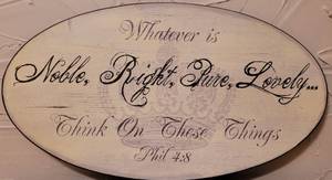 lot 227 image: OVAL DECORATIVE WALL DECOR HANGING IN STYLE, COLOR, AND CONDITION SHOWN.