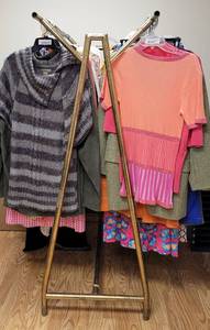 lot 274 image: TWO-SIDED CLOTHING RACK DISPLAY IN STYLE, COLOR, AND CONDITION SHOWN. RACK ONLY