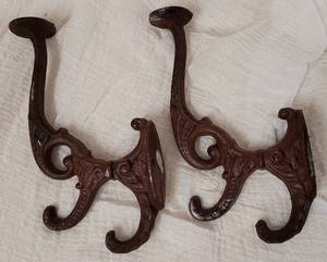 lot 292 image: LOT OF 2 CAST IRON WALL HOOKS  HANGERS AS SHOWN. (YOUR BID X 2)