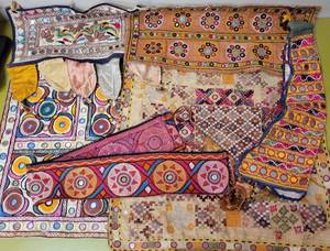 lot 321 image: LOT OF TRIBAL KUTCHI EMBROIDERED BORDERS IN STYLES, COLORS, AND CONDITION SHOWN. HAND MADE IN INDIA.