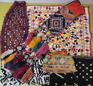 lot 323 image: LOT OF TRIBAL KUTCHI EMBROIDERED BORDERS IN STYLES, COLORS, AND CONDITION SHOWN. HAND MADE IN INDIA.