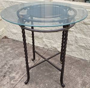 lot 335 image: WROUGHT IRON STYLE BASE WITH GLASS TOP TABLE IN STYLE, COLOR, AND CONDITION SHOWN.