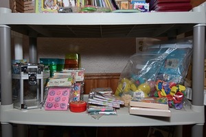 lot 16 image: Assorted note pads, dry erase boards, kids games, and other supplies