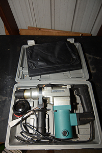 lot 230 image: 1 electric hammer drill with casing