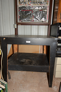 lot 234 image: Black garage workstorage table
