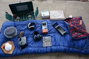 lot 70 image: Hunting equipment including Century Primus propane stove, Comoys stainless steel flask, Colemans sleeping bag, noise-cancelling ear muffs, & canteen