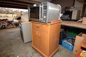 lot 54 image: Oster Stainless Steel Microwave Oven and Utility Cart