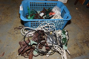 lot 67 image: Assorted power cords & plastic clothes basket
